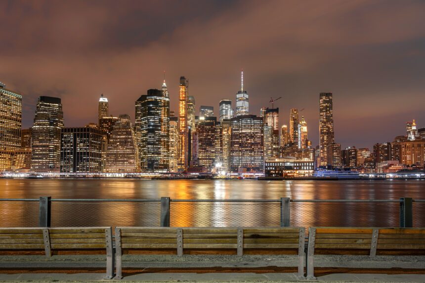 New York Cityscape beside the east river at the night time, USA downtown, Architecture and building